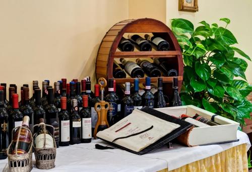 a table with a bunch of bottles of wine at Best Western Hotel La Solara in Sorrento