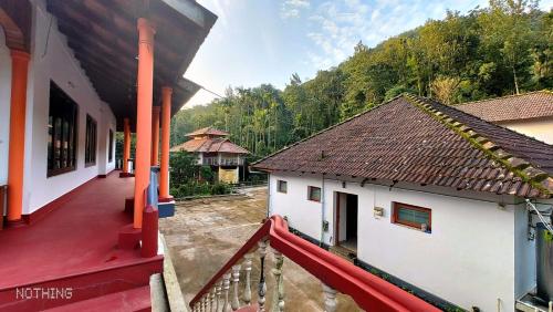 an aerial view of a building with at Divine Gift Coorg Homestay in Suntikoppa