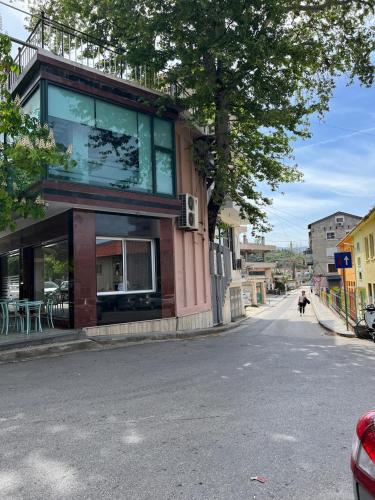 a building on the side of a street at Sam's Apartment in Berat