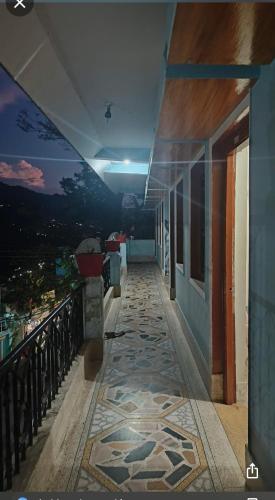 a hallway of a building with a tile floor at Maharastra mandal in Gupta Kāshi