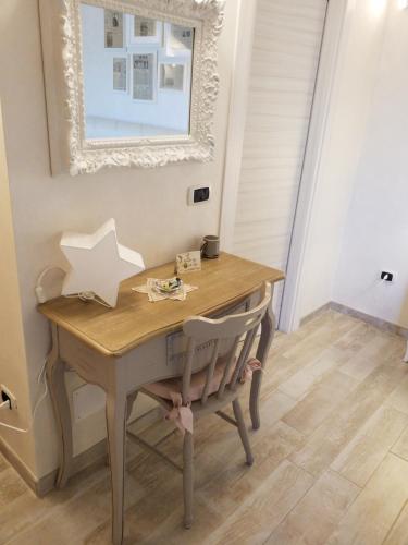 a wooden table with a star on it in a room at La Vista del Poggio in Castellaro