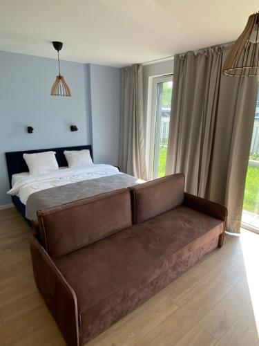 A bed or beds in a room at BlueHouse Apartment Warsaw
