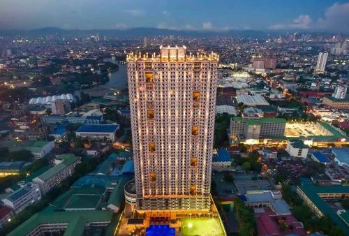 an overhead view of a tall building in a city at Torre De Manila Stunning Apartment in Manila