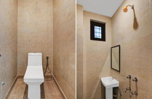 a bathroom with a toilet and a sink at Om villa in New Delhi