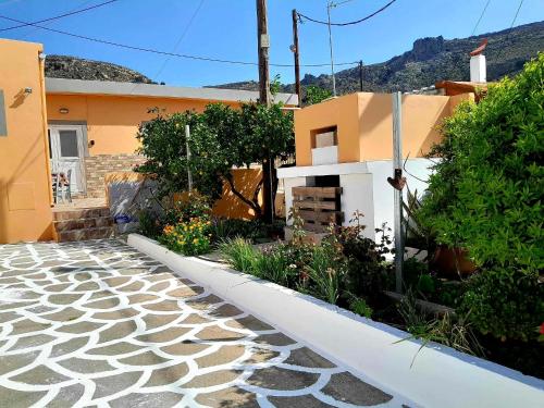 a house with a garden in front of it at Katerina's House in Sitia