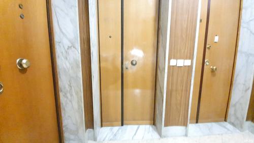 a reflection of a closet with glass doors at Limited Edition Guesthouse in Bari