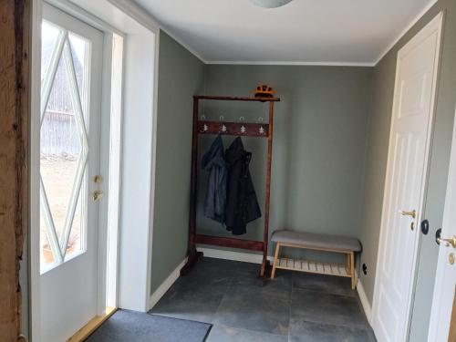a room with a closet with a chair and a window at Privacy within city limits in Tartu