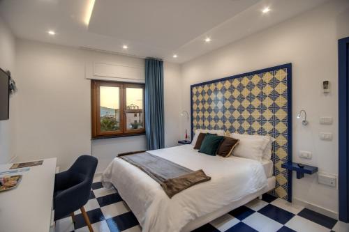 Postel nebo postele na pokoji v ubytování Maison Serena Sorrento