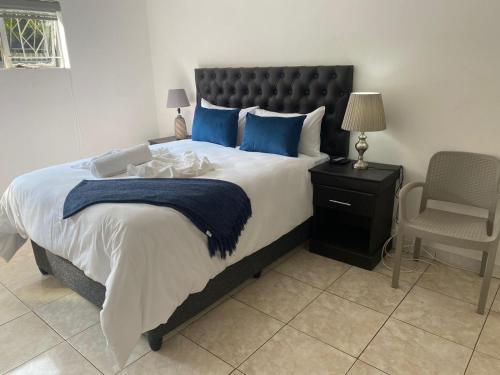 Ένα ή περισσότερα κρεβάτια σε δωμάτιο στο Creekside Guest House Middelburg