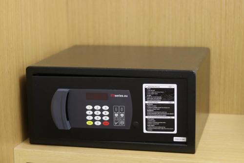 a microwave oven sitting on top of a shelf at ARXONTIKO in Himare
