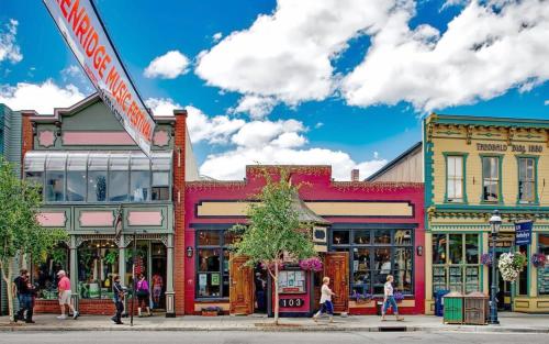 a group of shops on a street in a town at Cozy 2BR Condo Near Peak 8 and Town with Hot Tub Access in Breckenridge