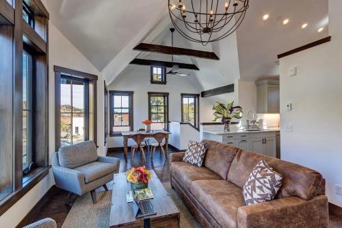a living room with a couch and a table at Aurum Condo - 1 BR with Mtn Views, Steps from Main St in Breckenridge