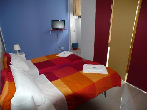 Cama o camas de una habitación en Sicily Rooms Enna