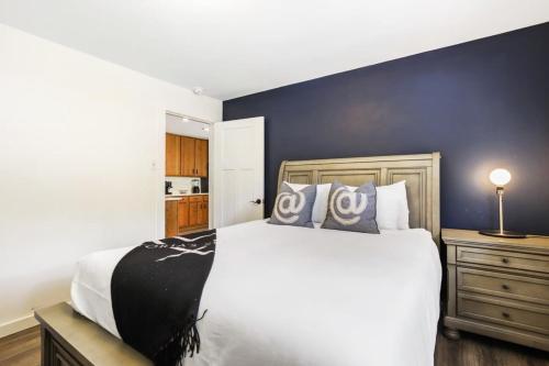 a bedroom with a large bed and a blue wall at Stunning 4 BR Home Mountain Views Tranquil Setting in Breckenridge