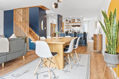 a dining room and living room with a table and chairs at Stylish 2BR Near Trails and Slopes in Dillon