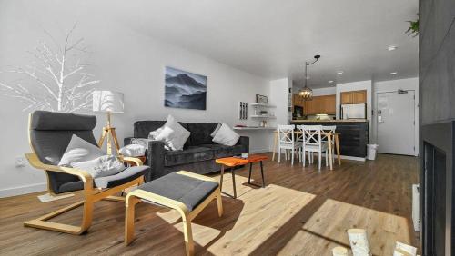 a living room with a couch and chairs and a kitchen at Lakeside 1BR 4-Min to Keystone Ski Resort in Keystone