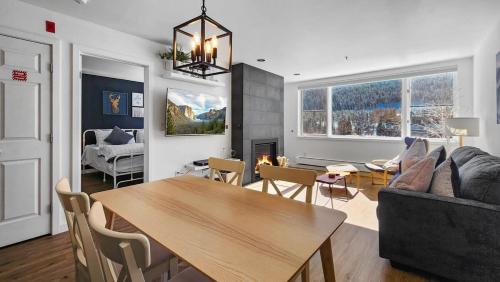a living room with a table and a couch at Lakeside 1BR 4-Min to Keystone Ski Resort in Keystone