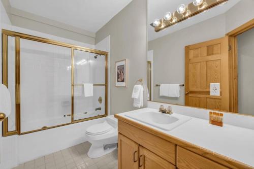 a bathroom with a sink and a toilet at Steps From Ski Lift Garage Parking Included in Park City