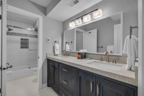 a bathroom with a double sink and a shower at Park City Canyons Ski Cabriolet Community Amenity in Park City