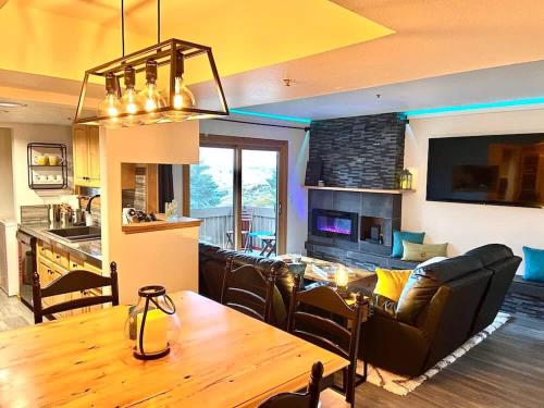 a living room with a couch and a table in a room at Stylish 2BR Condo Near Olympic Park and Ski Resorts in Park City