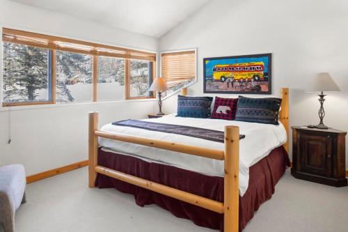 a bedroom with a large bed and windows at 3BR Townhome Incredible Location in Park City