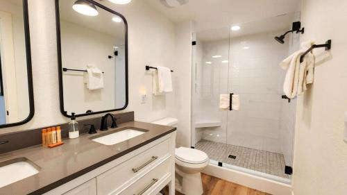 a bathroom with a shower and a sink and a toilet at Modern 3BR in Serene Area Near Ski Slopes and Town in Park City