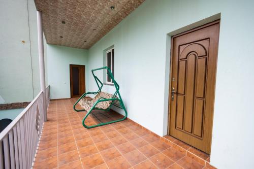 a house hallway with a staircase and a door at YAN HOTEL in Yerevan