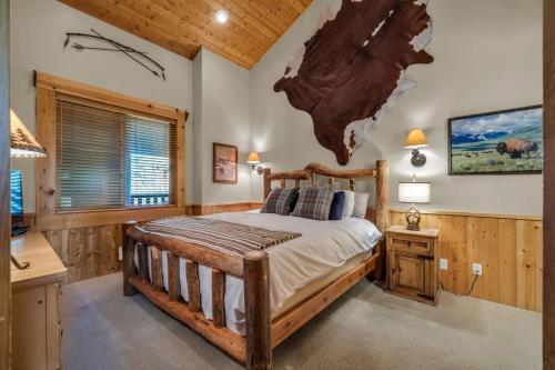 a bedroom with a bed with a map on the wall at Luxurious 2BDR in Deer Valley with Hot Tub in Park City