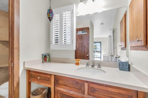a bathroom with a sink and a mirror at 3BR with Loft Townhouse 3 Min Walk to Ski Lift in Park City