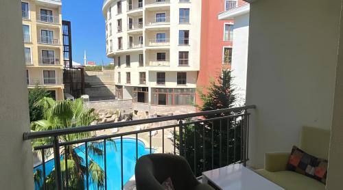 a balcony with a view of a pool and buildings at SANTE TERMAL HOTEL in Yalova