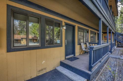 a porch of a house with a bench on it at Lakeside Studio Steps from the Beach in Tahoe Vista