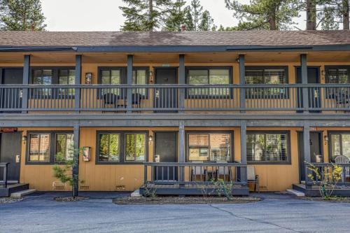 a large house with a balcony on top of it at Lakeside Studio Steps from the Beach in Tahoe Vista