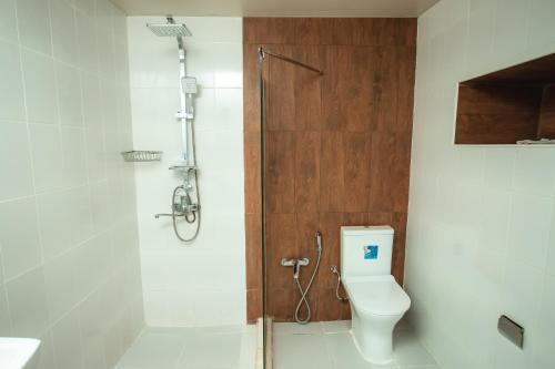 a bathroom with a shower and a toilet and a shower at Moss Art Boutique Hotel in Baku