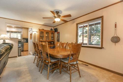 a dining room with a table and chairs and a ceiling fan at Serene 5BDR Near Beach and Forest Trails in Carnelian Bay