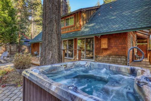 a hot tub in front of a house at Serene 5BDR Near Beach and Forest Trails in Carnelian Bay
