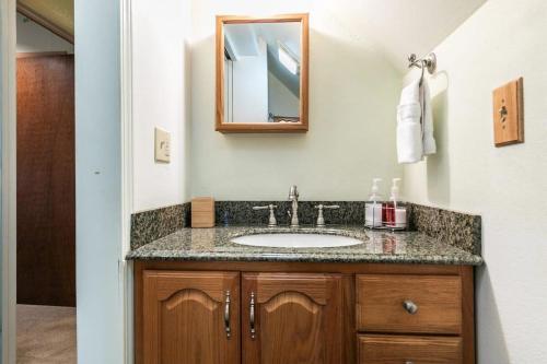 a bathroom with a sink and a mirror at Serene 5BDR Near Beach and Forest Trails in Carnelian Bay