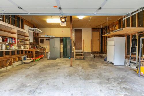 an empty room with a kitchen and a refrigerator at Serene 5BDR Near Beach and Forest Trails in Carnelian Bay