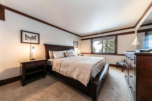 a bedroom with a bed and a desk and a sink at 4BD Lakeside Retreat with Views in Tahoe City