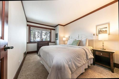 a bedroom with a large bed and a window at 4BD Lakeside Retreat with Views in Tahoe City