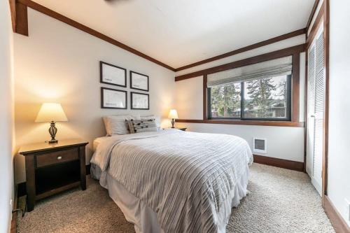 a bedroom with a large bed and a window at 4BD Lakeside Retreat with Views in Tahoe City