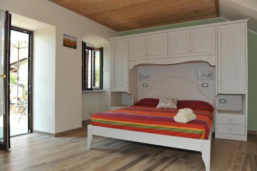 a bedroom with a bed with a canopy at Affittacamere Belvedere in Sordevolo