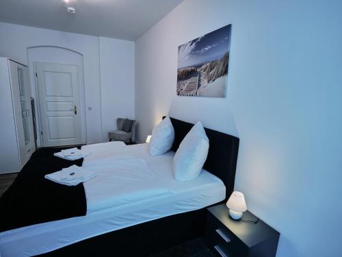 Postel nebo postele na pokoji v ubytování Apartment OTTO II - Erfurt Zentrum