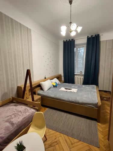 Postel nebo postele na pokoji v ubytování ArArAt-KLOVSKAYA HOSTEL-APARTMENTS KIEV