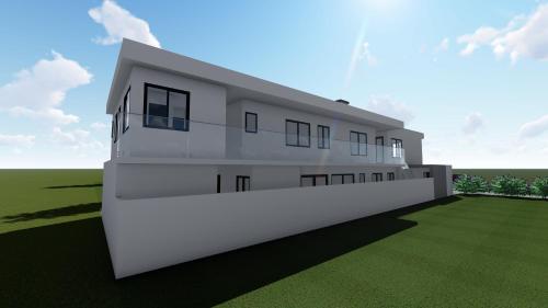 a rendering of a white building at Briques Luxes Constructions in Lomé