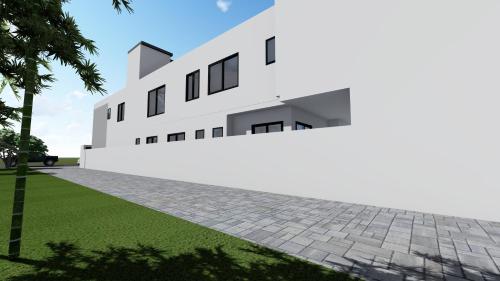 a rendering of a white building with a stone driveway at Briques Luxes Constructions in Lomé