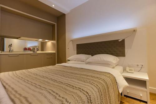 Ліжко або ліжка в номері Cozy Apartment In The Heart of Batumi