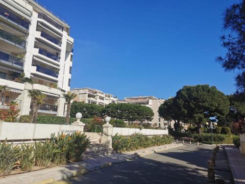 an empty street in front of a building at Lido, private apartment seaside, parking, swimming pool close to Nice in Cagnes-sur-Mer
