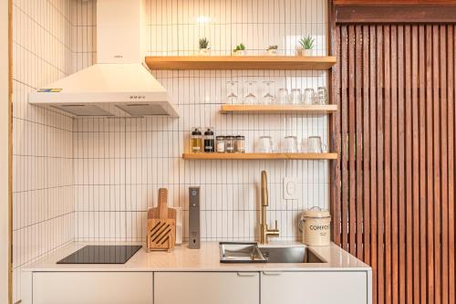 a kitchen with a sink and a counter top at Le Village Aewol G in Jeju
