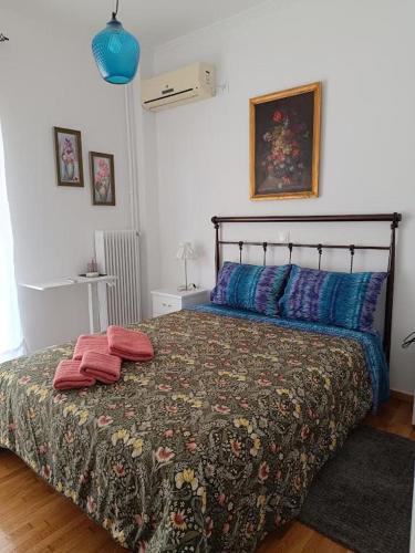 a bedroom with a bed with two pillows on it at Panormou studio comfortable max two guests in Athens