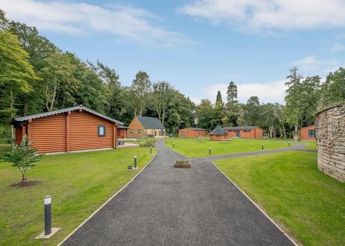 a path leading to a cabin in a park at Gadgirth Estate Lodges in Annbank